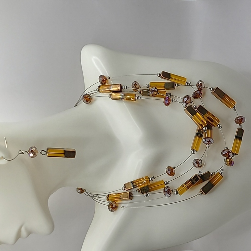Contemporary multi strand beaded amethyst colored necklace and earrings set